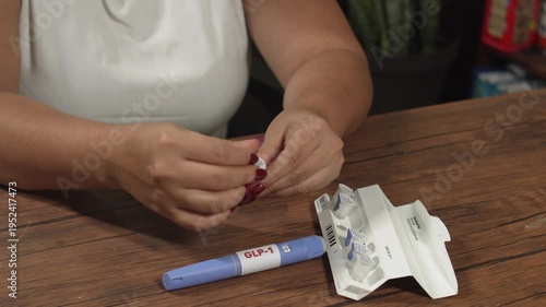 Wallpaper Mural Female preparing Semaglutide GLP-1 pen for self-administered injection at home, obesity treatment Torontodigital.ca