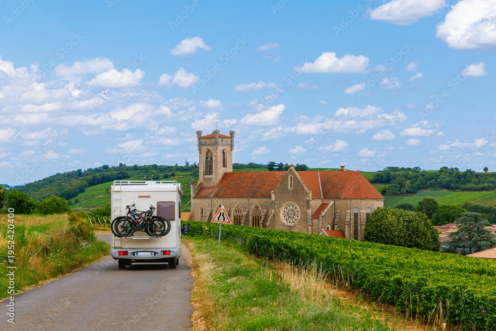 Fototapeta premium motor hom driving on the road in France, countryside. Adventure, road trip, summer holiday, exploration