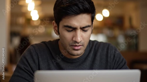 Wallpaper Mural Frustrated Young Man Looking at Laptop Screen in Cafe Feeling Confused or Dissatisfied with Online Content Torontodigital.ca