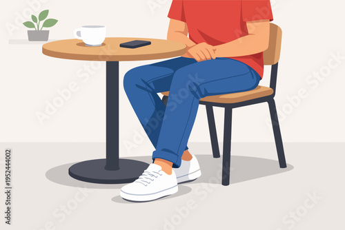 Person sitting at cafe table with coffee and smartphone, taking a break, waiting or relaxing