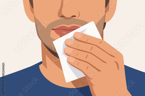 Man is seen using a white napkin to clean his lips, demonstrating good manners, hygiene, and self-care