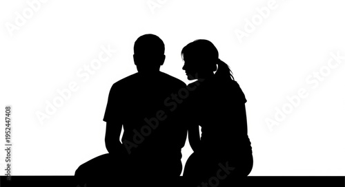 Silhouette of a Couple in Deep Conversation Against a White Backdrop.