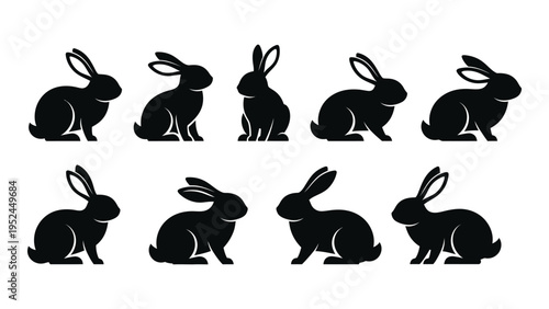 Silhouettes of rabbits in various sitting and alert poses black and white