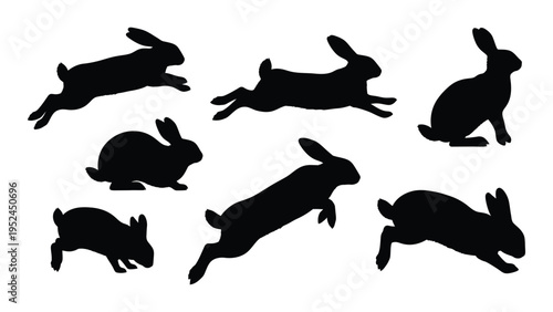 Silhouettes of multiple rabbits in various leaping and sitting poses