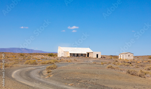 Old farm buildings in Karoo desert landscape