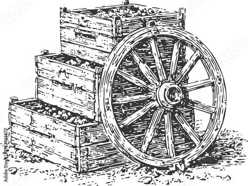 vintage wooden cartwheel leaning against stacked wooden crates filled with stones in rustic