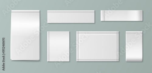 White fabric label mockup with realistic woven texture. Blank cotton tag sewn on cloth garment with detailed stitching, vector set isolated on background. Brand identity and apparel design product