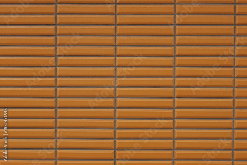 Orange glazed ceramic tile wall pattern texture background