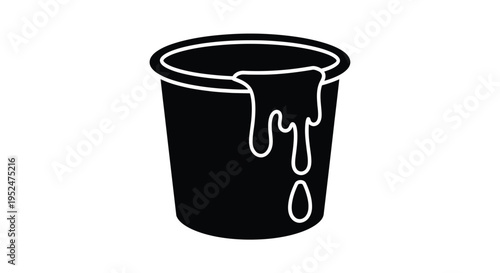 Black silhouette of a bucket with dripping overflowing liquid inside