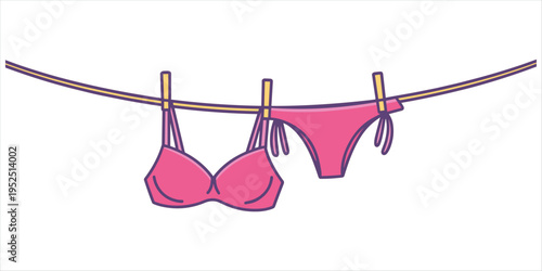 Pink bikini and bra hanging on a clothesline with yellow clothespins underwear swimwear
