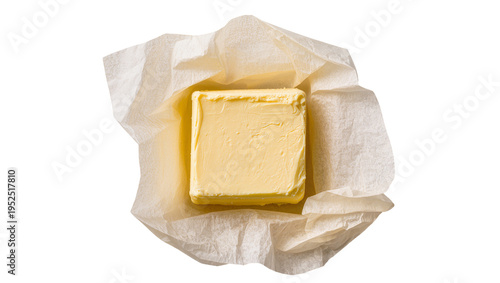 Canvastavla Isolated block of fresh butter partially unwrapped in parchment paper for cookin