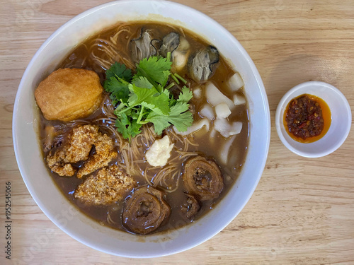 Taiwanese noodle soup with meatballs, mushrooms and herbs in rich broth.