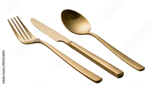 Tableau sur toile Isolated luxurious golden cutlery set with fork, serrated knife, and spoon for m