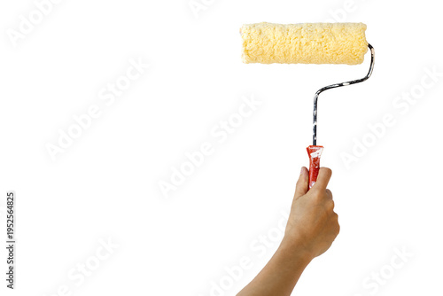 A hand holding a horizontal paint roller loaded with cream-colored paint, isolated against a solid white background, perfect for home renovation or DIY concepts.