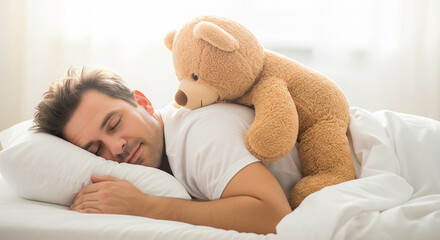 Young man resting comfortably in white bed holding teddy bear perfect for peaceful morning and sweet dream goal