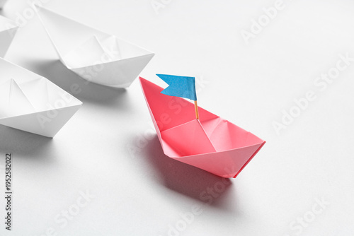 One origami boat with flag ...