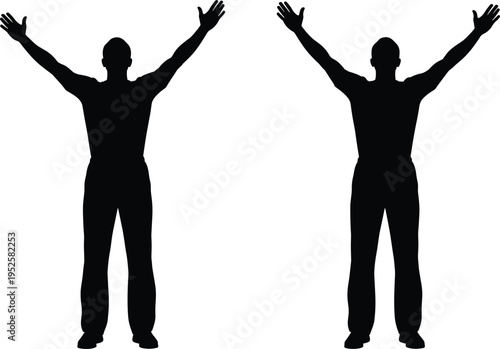 Silhouette of a successful man standing with open arms raised towards the sky expressing freedom, victory, joy, and spiritual inspiration. (20 words)