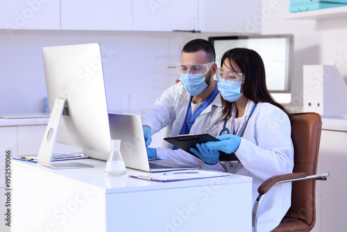 Young doctors analyzing sci...
