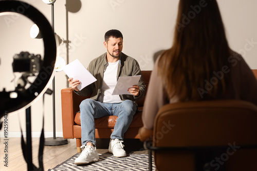 Photos Male actor with film script and producer acting in audition room