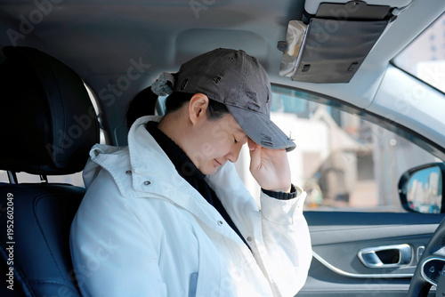 Wallpaper Mural Tired Person with Headache in Car Interior Torontodigital.ca