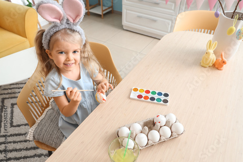 Cute little girl in bunny e...