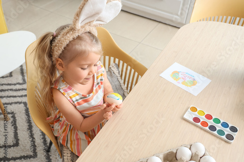 Cute little girl in bunny e...