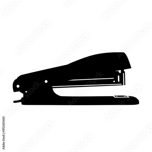 Black office stapler side view.