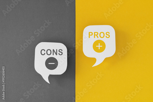Pros and Cons text on real white speech bubble paper cut on grey and yellow background
