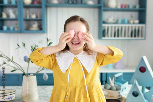 Wallpaper Mural Closeup Portrait of funny cute kid girl covering eyes with Easter eggs. Cheerful beautiful smiling little girl holding an easter eggs in her hands, closes eyes, kid celebrate easter. Torontodigital.ca