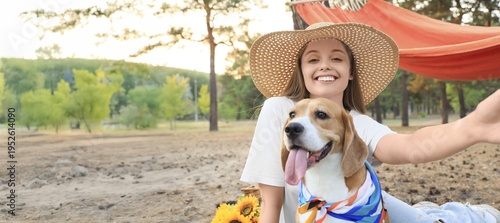 Young woman with Beagle dog...