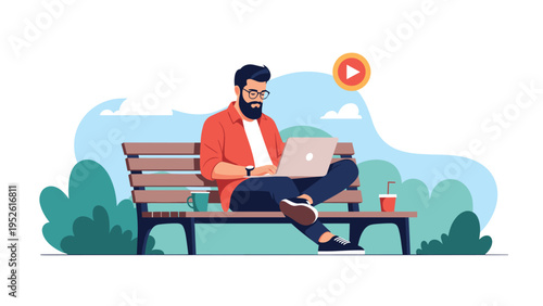 Young man with a beard sits on a park bench working on his laptop while enjoying coffee in a serene outdoor environment with trees.