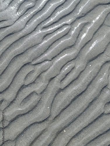 beach and wet sand in shallow water