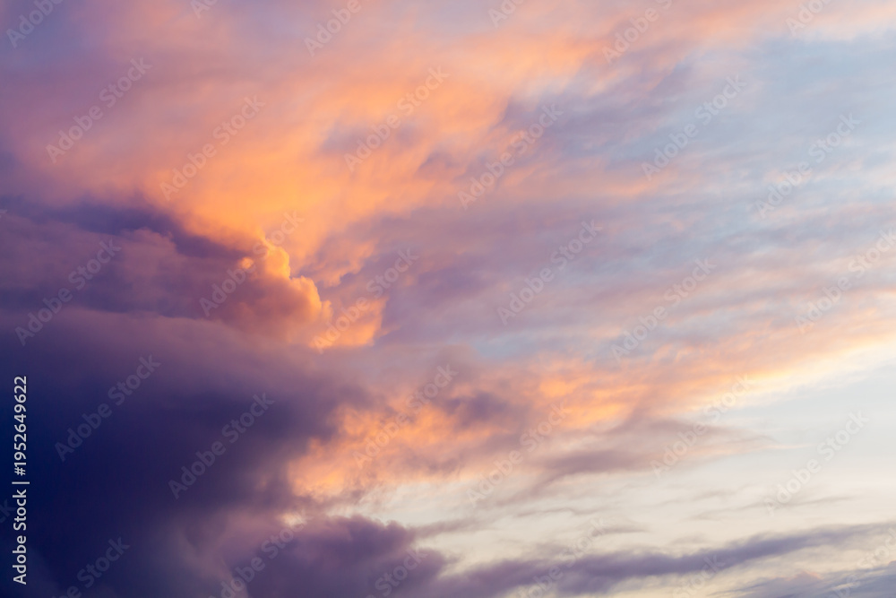 Fototapeta premium Dramatic sunset sky with colorful orange and purple storm clouds