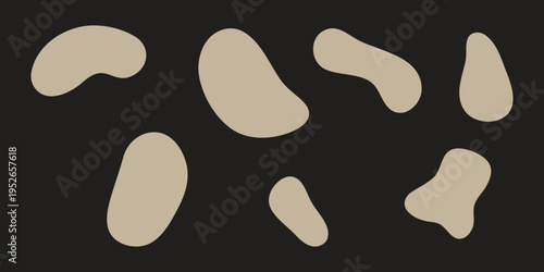 Collection of irregularly shaped beige objects on a black background