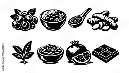 Monochrome superfood set featuring blueberries turmeric leaf cocoa pomegranate chia seeds