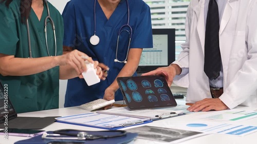 Medical team working on digital tablet healthcare doctor technology tablet using computer analyzed the results of medical reports at the hospital