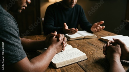 Wallpaper Mural communal faith, prayer, bible, devotion, community, men, christianity, spirituality and fellowship as a group of black men study the holy scriptures together around a wooden table. Torontodigital.ca
