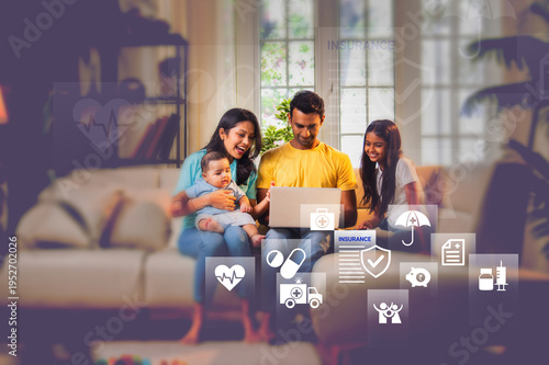 Indian parents and kids on sofa looking at laptop. Visualizing online health insurance, digital savings, and financial growth for the family.