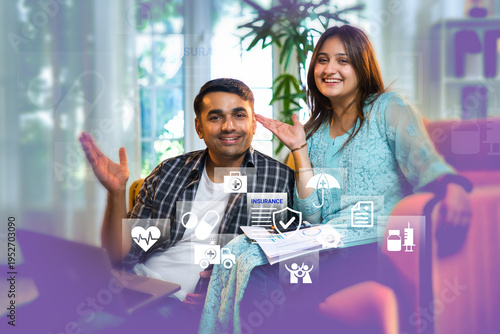 Young Indian couple on sofa using laptop for home insurance. Infographic highlights life protection, medical cover, and financial security.