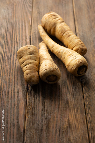 Fresh parsnip roots winter vegetables close up rustic surface