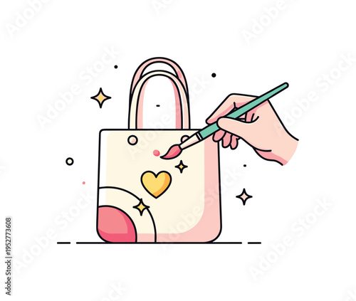 Hand painted clothing design brush painting a small heart on a tote bag with subtle star accents, representing artistic customization and wearable art.