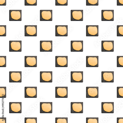Cookie dough squares on baking sheets creating a repeating tiled pattern