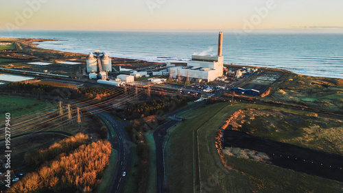 Lynemouth Northumberland: 31st Dec 2025: Lynemouth Power Station stands on a winter morning. The sun rises, casting light on the buildings and nearby coastline