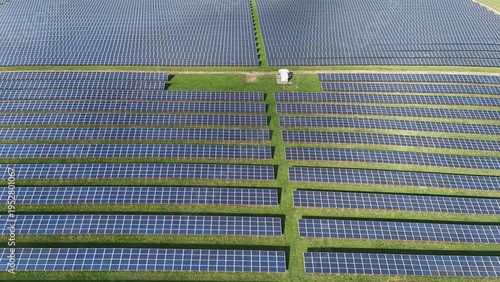 Aerial view of rows of solar panels absorb the sun's rays, energy farm generating clean energy, Mansfield, England, United Kingdom.
