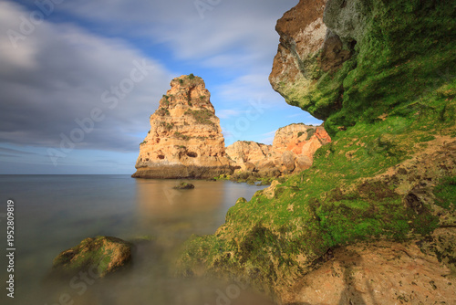 Beautiful rocky beach praia da marinha near Carvoeiro at the coast of Algarve, Portugal. Wonderful landscape and seascape for tourism and travel and nature topics.