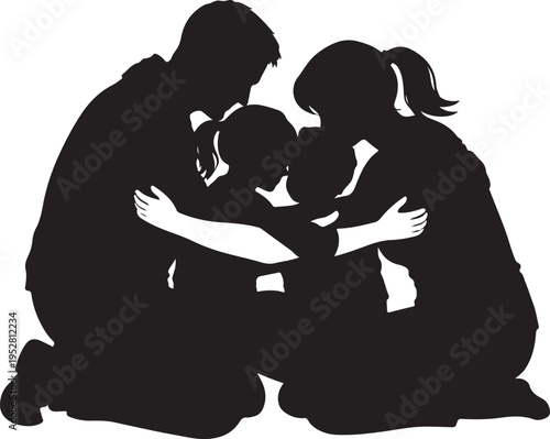Silhouette of a loving family of four sharing a warm group hug while kneeling together