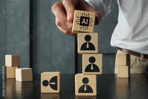 Artificial intelligence replacing workforce concept with wooden blocks showing AI symbol on top of human figures, automation, job displacement, technology impact on employment and business