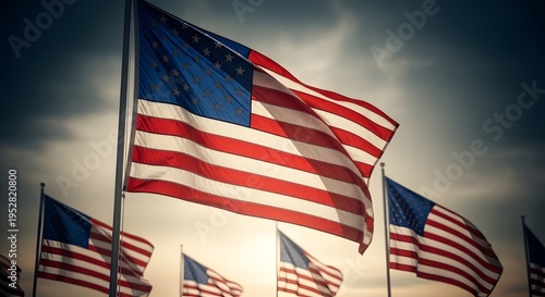American Flags Waving Proudly Against Cloudy Sky.
