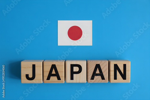 Wooden blocks spelling out the word japan positioned below the national flag of the country japan Free Download Wooden blocks spelling out the word japan positioned below the national flag of the country japan - GFXLoad