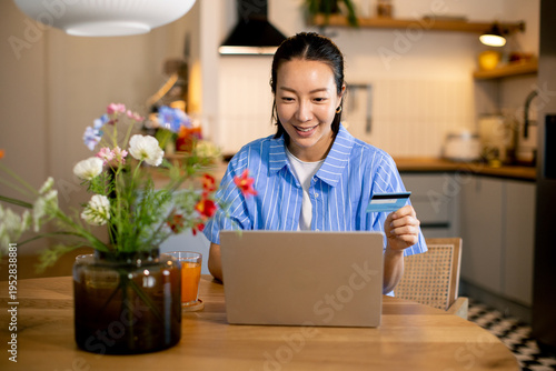 Woman shopping online in ki...